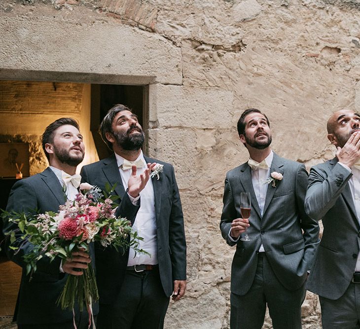 Groomsmen in Grey Suits &amp; Pink Bow Ties | Luxe Blush Pink Glasshouse Wedding at Cortal Gran, Spain Planned by La Puta Suegra  | Sara Lobla Photography