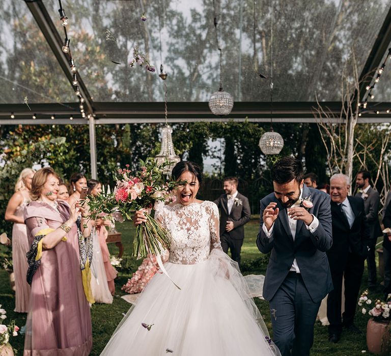 Confetti Exit | Bride in Rosa Clara Princess Gown | Groom in Grey Suit | Luxe Blush Pink Glasshouse Wedding at Cortal Gran, Spain Planned by La Puta Suegra  | Sara Lobla Photography