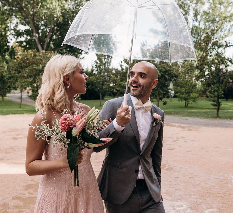 Groomsman in Grey suit | Bridesmaid in Pink Dress | Luxe Blush Pink Glasshouse Wedding at Cortal Gran, Spain Planned by La Puta Suegra  | Sara Lobla Photography