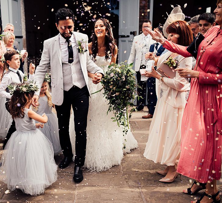 Family confetti exit at Dorfold Hall wedding venue