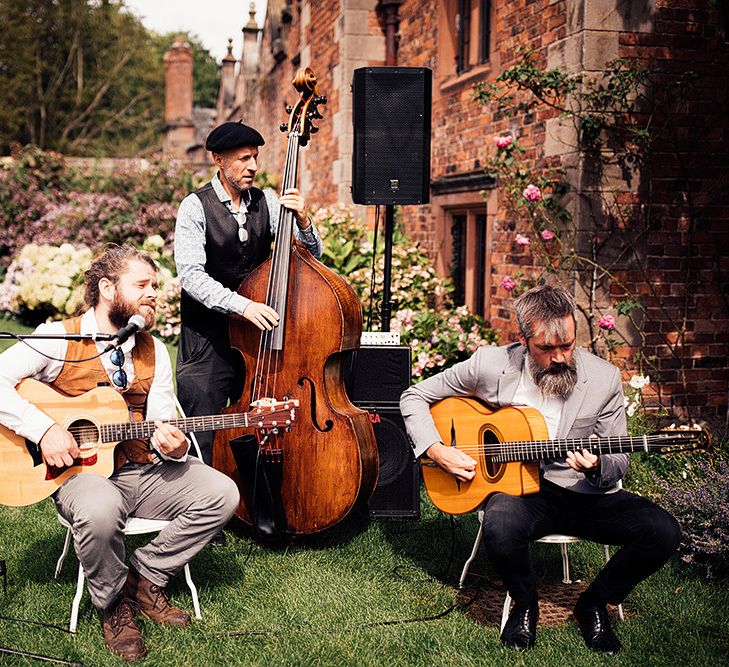 Wedding band playing on the lawn at Dorfold Hall