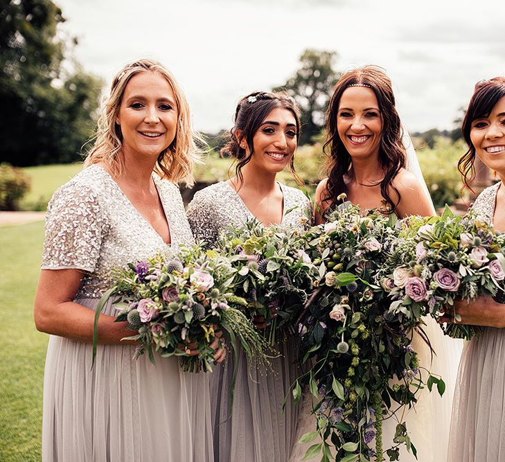 Bridal party with bridesmaids in grey sequin and tulle dresses