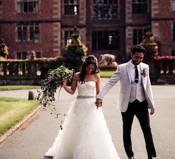 Bride in separates and groom in grey blazer at Dorfold Hall wedding