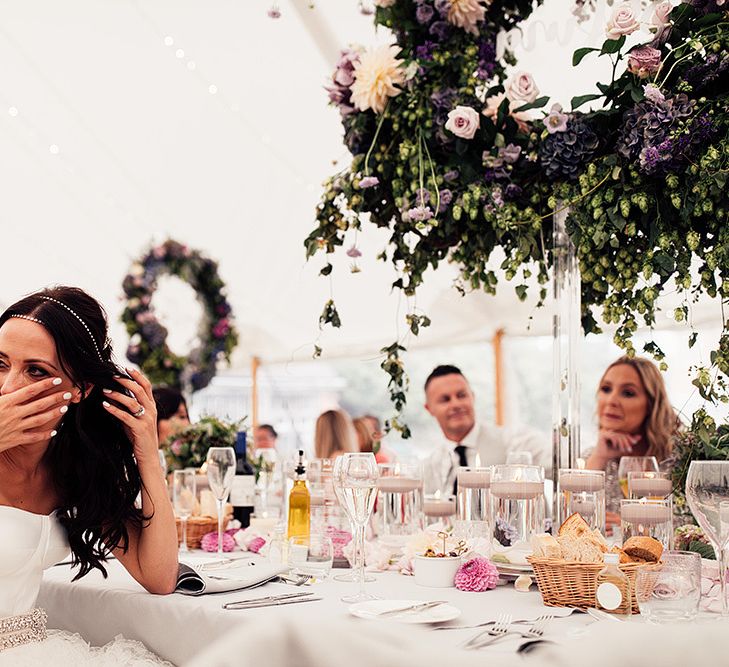 Bride laughing during the wedding speeches