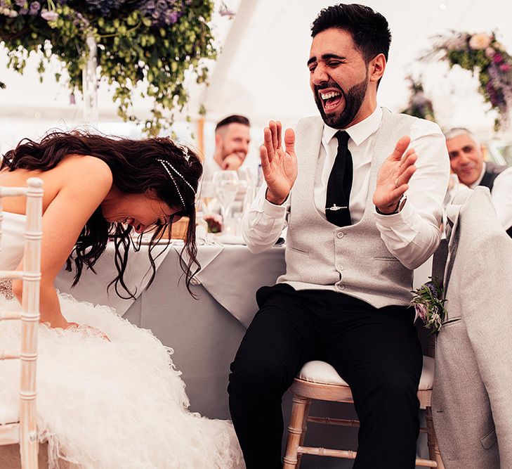 Bride and groom laughing during the Dorfold Hall wedding reception speeches