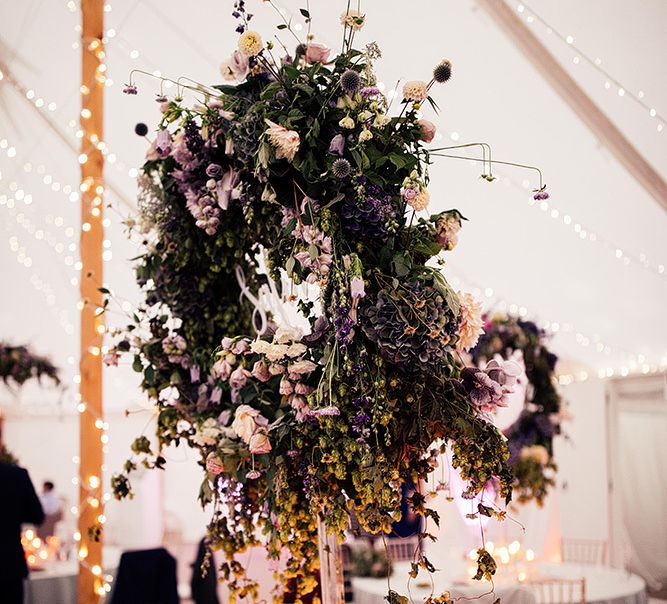 Floral hoop wedding decor and candle light at Dorfold Hall wedding reception