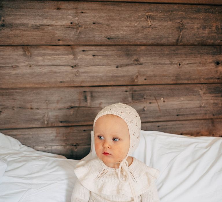 Flower Girl With Knitted Bonnet // Nancarrow Farm Cornwall Wedding With Images From Dale Weeks &amp; Bride In Maggie Sottero With Wild Flower Bouquet &amp; Hand Knitted Flower Girl Outfit