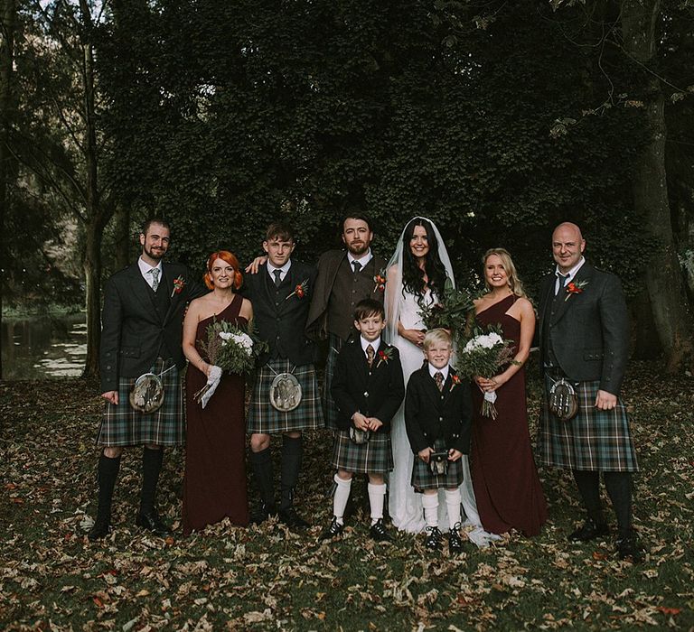 Wedding Party | Bride in Enzoani Gown | Bridesmaids in Burgundy Sorella Vita Dresses | Groomsmen in Tartan Kilts | Autumnal Scottish Woodland Wedding at Fernie Castle | Maureen Du Preez Photography