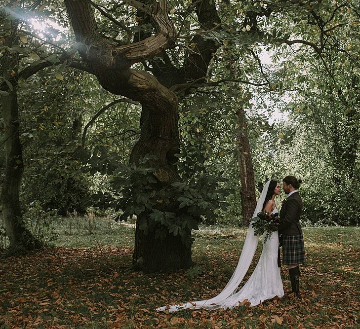 Bride in Enzoani Gown | Groom in Tartan Kilt | Autumnal Scottish Woodland Wedding at Fernie Castle | Maureen Du Preez Photography