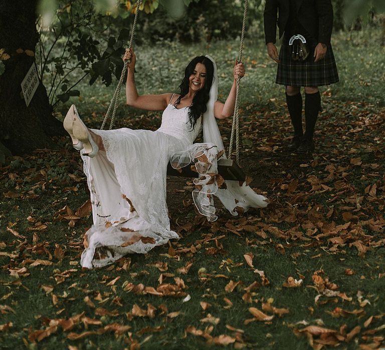 Swing Portrait | Bride in Enzoani Gown | Groom in Tartan Kilt | Autumnal Scottish Woodland Wedding at Fernie Castle | Maureen Du Preez Photography