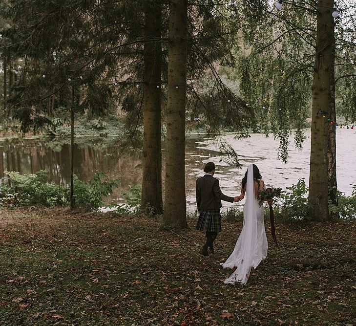 Lakeside Portrait | Bride in Enzoani Gown | Groom in Tartan Kilt | Autumnal Scottish Woodland Wedding at Fernie Castle | Maureen Du Preez Photography