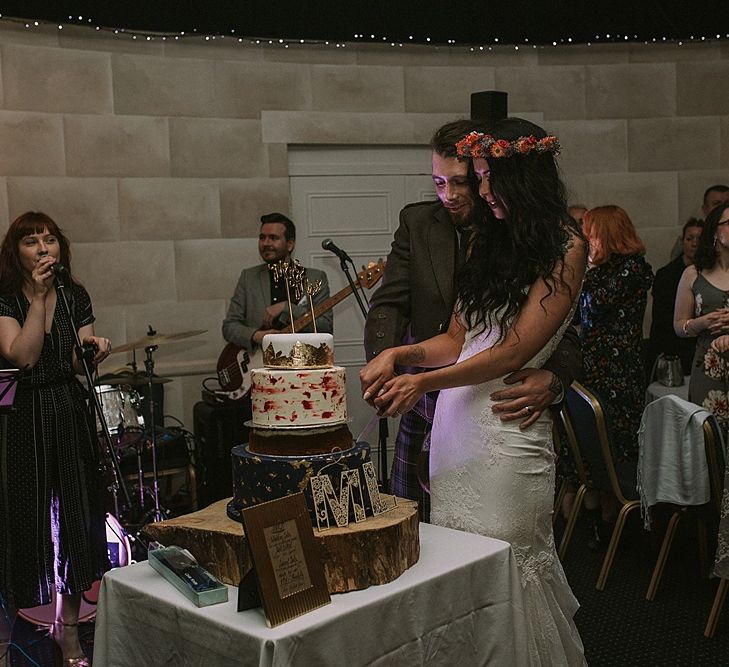 Cutting the Cake | Bride in Enzoani Gown | Groom in Tartan Kilt | Autumnal Scottish Woodland Wedding at Fernie Castle | Maureen Du Preez Photography