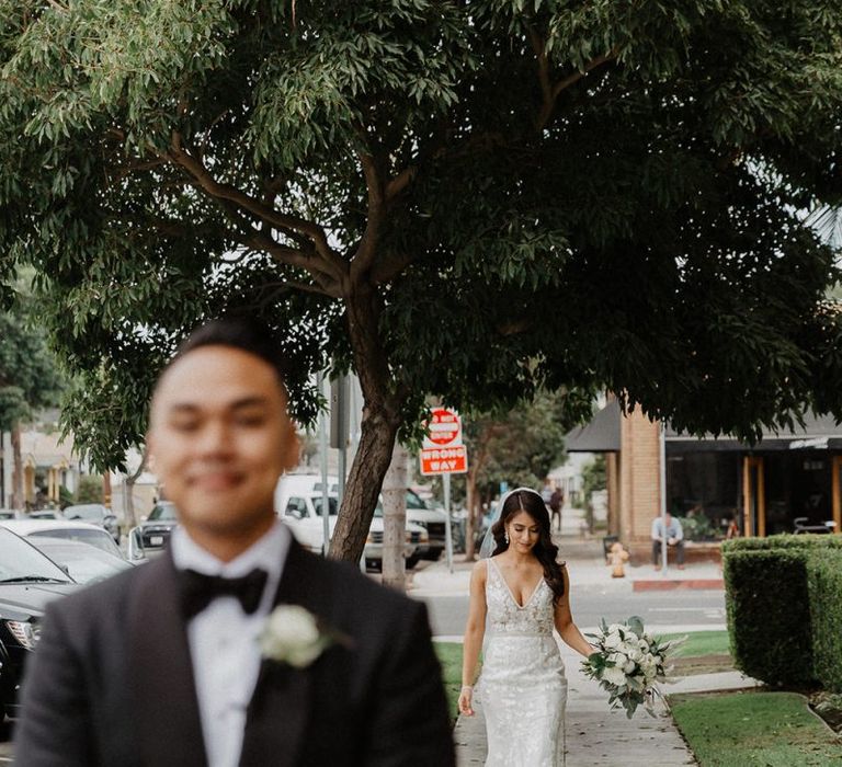 Bride walks up to groom at first look