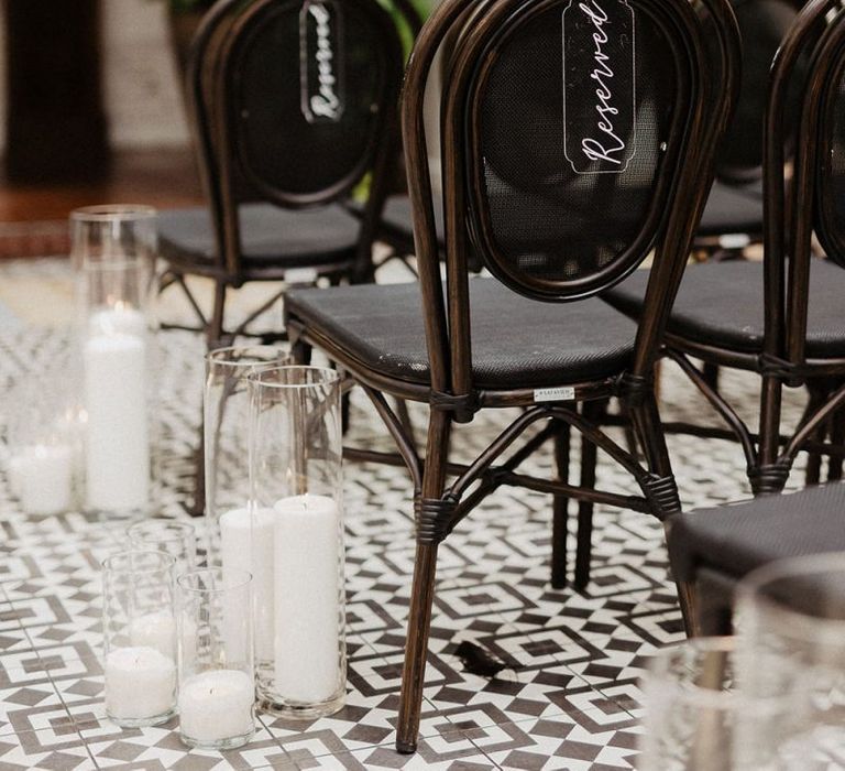 Black and white colour scheme wedding decor and chair signs