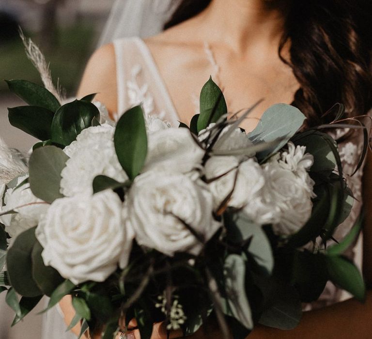 White wedding bouquet for bride in lace dress