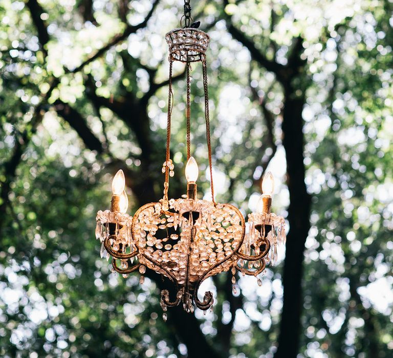 Outdoor Wedding Ceremony Decor | Chandelier Suspended from Trees | Outdoor Wedding Ceremony Decor