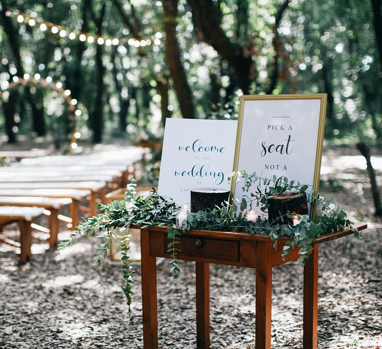 Outdoor Wedding Ceremony Decor | Welcome Sign | Table Decorated with Greenery and Candles | Fairy Light Moon Gate Altar | Festoon Lights | Puglian Countryside Wedding with Fairy Light Altar and Olive Grove Aperitivo | Figtree Wedding Photography