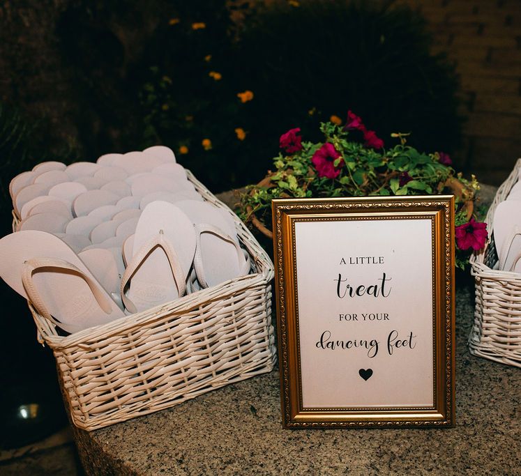 White Flip Flops in Baskets | Puglian Countryside Wedding with Fairy Light Altar and Olive Grove Aperitivo | Figtree Wedding Photography