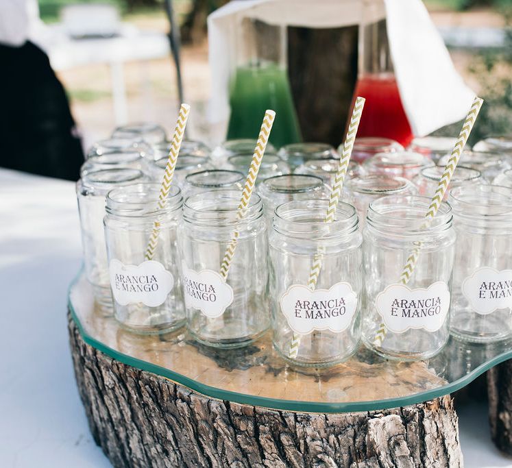 Aperitivo Hour in the Olive Grove at Tenuta Tresca | Mason Jar Drinking Glasses with Gold and White Chevron Straws | Puglian Countryside Wedding with Fairy Light Altar and Olive Grove Aperitivo | Figtree Wedding Photography