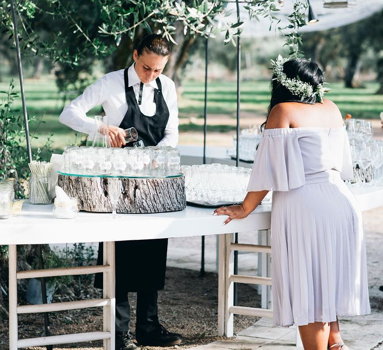 Aperitivo Hour in the Olive Grove at Tenuta Tresca | Mason Jar Drinking Glasses with Gold and White Chevron Straws | Bridesmaid in Lilac Dress | Flower Crown | Puglian Countryside Wedding with Fairy Light Altar and Olive Grove Aperitivo | Figtree Wedding Photography