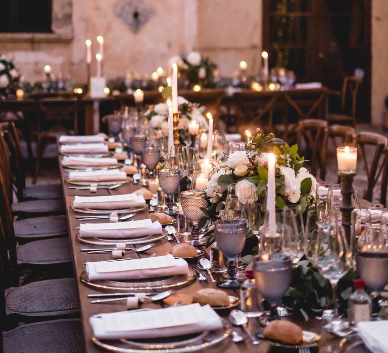 Outdoor Dining With Festoon Lights In Courtyard // Bride In Straw Hat With Leanne Marshall Wedding Dress Destination Wedding In Mallorca With Images From F2 Studios And Film By Alberto &amp; Yago