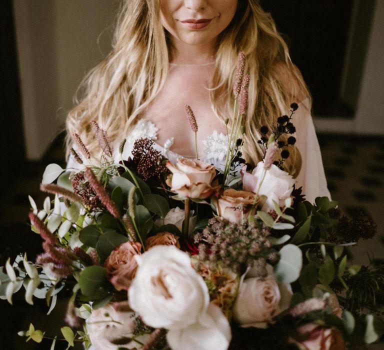 Bride with Half up half Down Hair Holding Her Wedding Bouquet