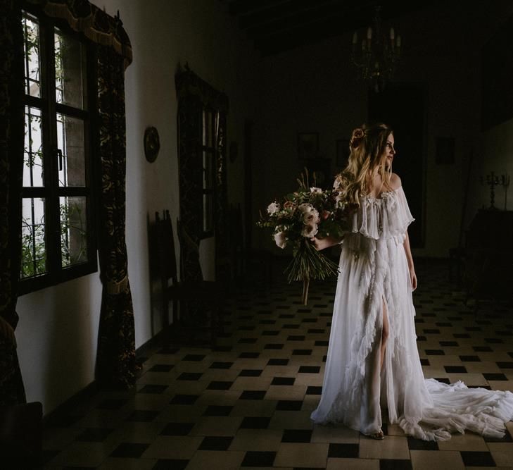 Bride in Ruffled Otilia Brailoiu 'Penelope' Wedding Dress Holding Her Wedding Bouquet