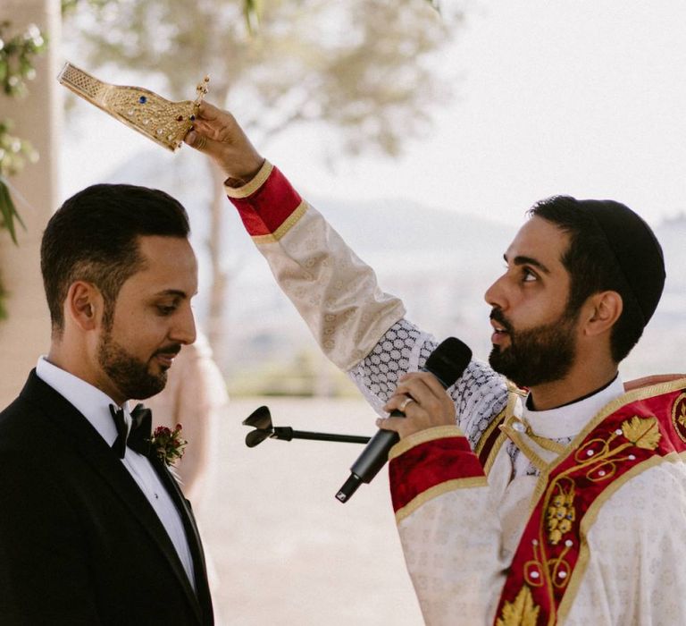 Groom Being Bless with a Crown During The Orthodox Wedding Ceremony