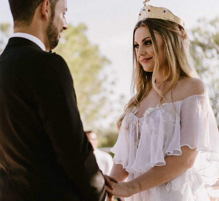 Bride and Groom Facing Each Other Holding Hands During the Orthodox Wedding Ceremony