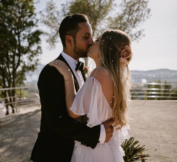 Bride and Groom Kissing After the Wedding Ceremony