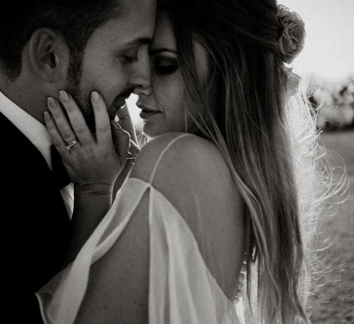 Black and White Portrait Of Bride and Groom Kissing