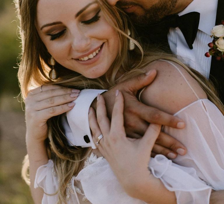 Bride and Groom Embracing at Sunset