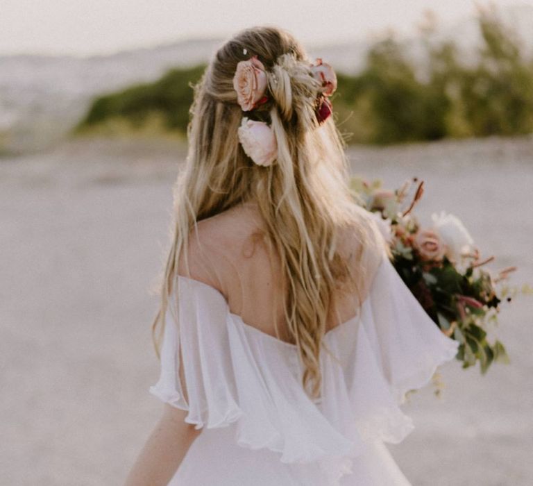 Bride Showing off Her Half Up Half Down Bridal Hairstyle with Fresh Flowers