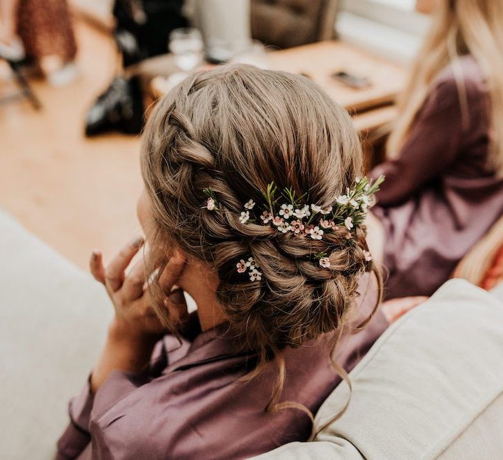 Braided bridesmaid hairstyle with fresh flowers for Priston Mill wedding