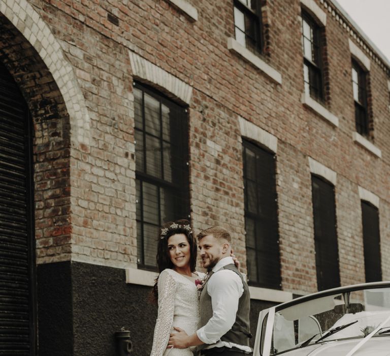 Bride and Groom Standing Next to VW Beetle Wedding Car