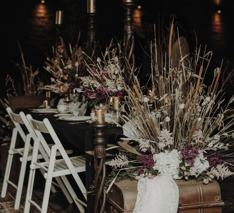 Tablescape with Wooden Chairs, Vintage Trunk and Dried Flower Arrangements