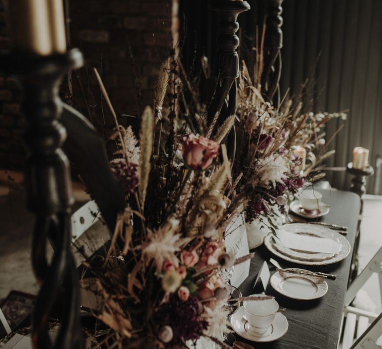 Floral Centrepieces featuring Dried poppy Heads and Grasses