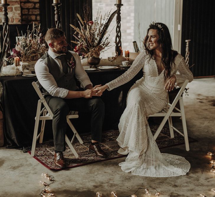 Boho Bride and Groom Holding Hands at Rustic TableScape in The Engine Works Glasgow