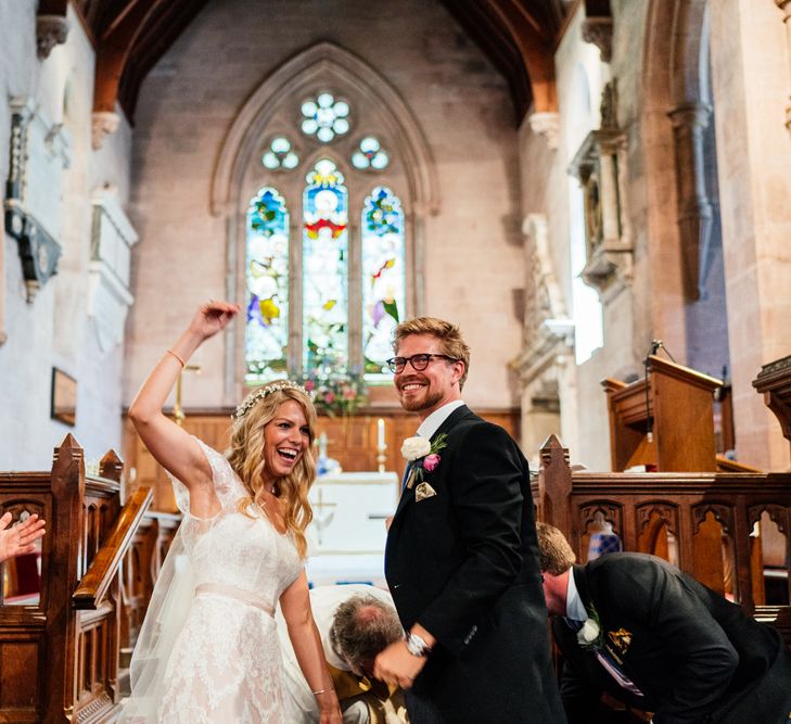 Bride in Lace Essence of Australia Wedding Dress and Groom in Morning Suit Just Married