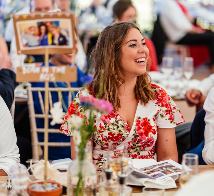 Wedding Guests Smiling During Wedding Reception Speeches