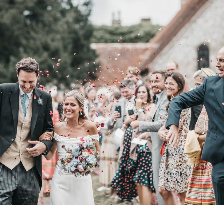 Confetti moment in church courtyard