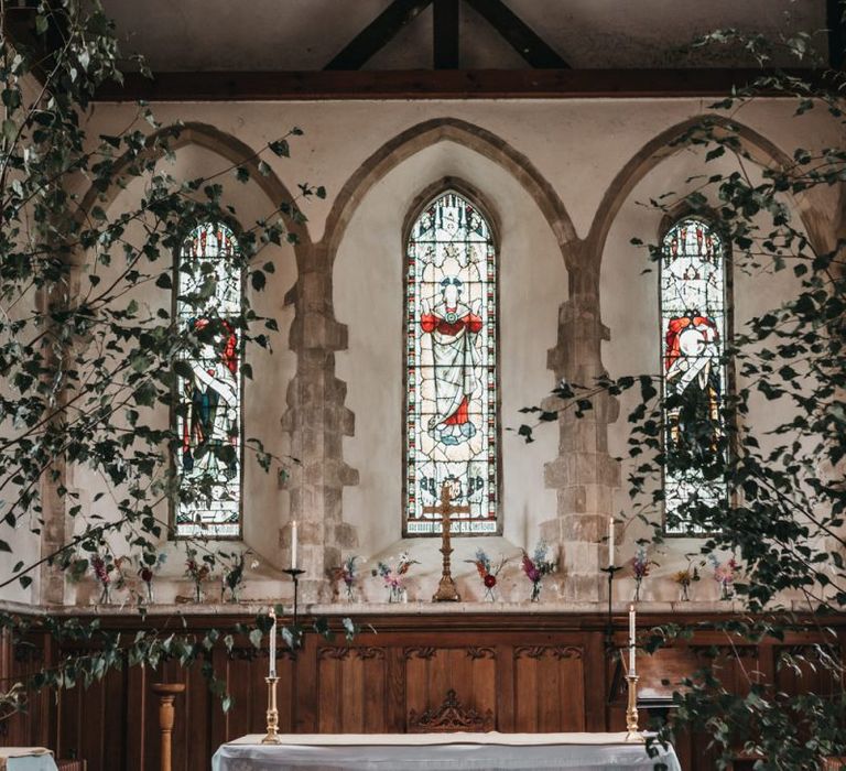 Church wedding ceremony altar with plant decor