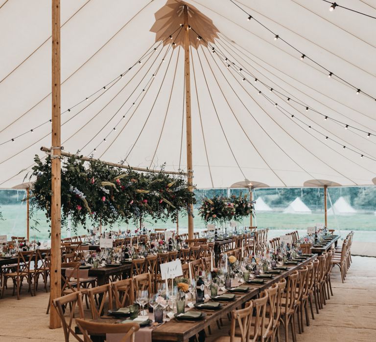 PapaKata Sperry tent reception with festoon lights and flower installation