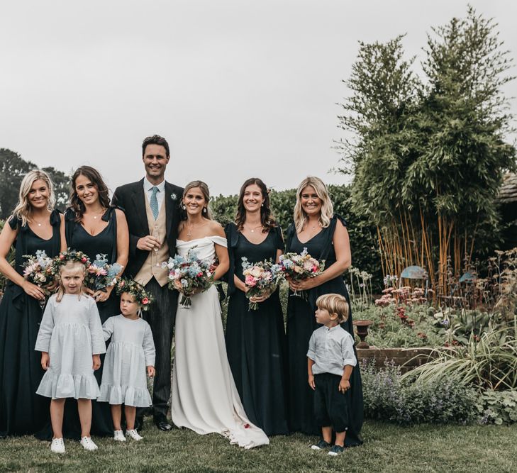 Bridal party portraits with bridesmaids in navy ReWritten dresses