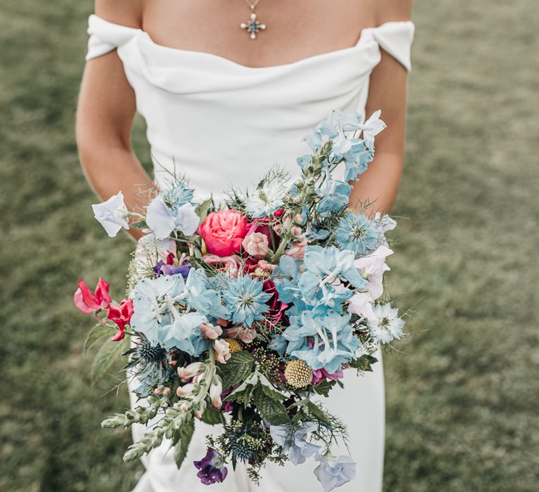 Blue and red wild flower wedding bouquet for church wedding