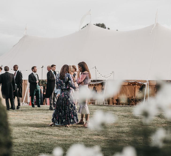 Outdoor Sperry tent reception at Brides family home