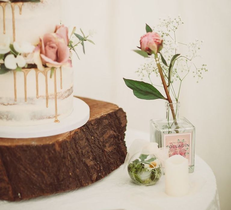 Drip Wedding Cake on Tree Trunk Slice