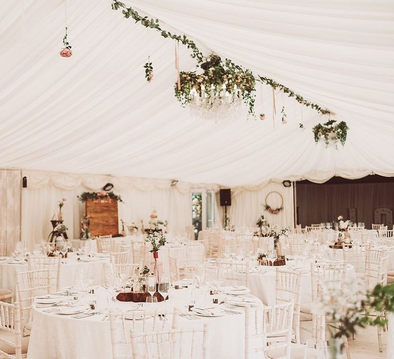 Reception with Chandelier Wrapped In Ivy