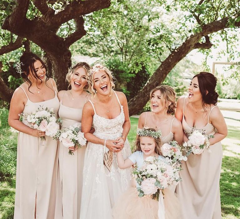 Bride in Lace Dress with Bridesmaids Wearing Pink ASOS Dresses