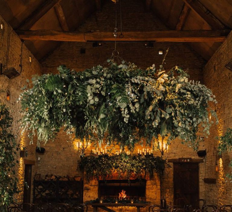 Foliage chandelier and candle light decor for November wedding